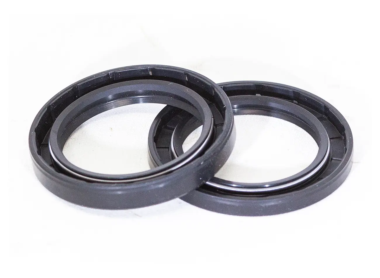 A pair of black rubber rings sitting on top of a white table.