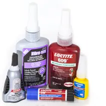 A group of different types of glue bottles.