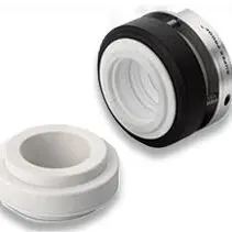 A white and black plastic cap next to each other.